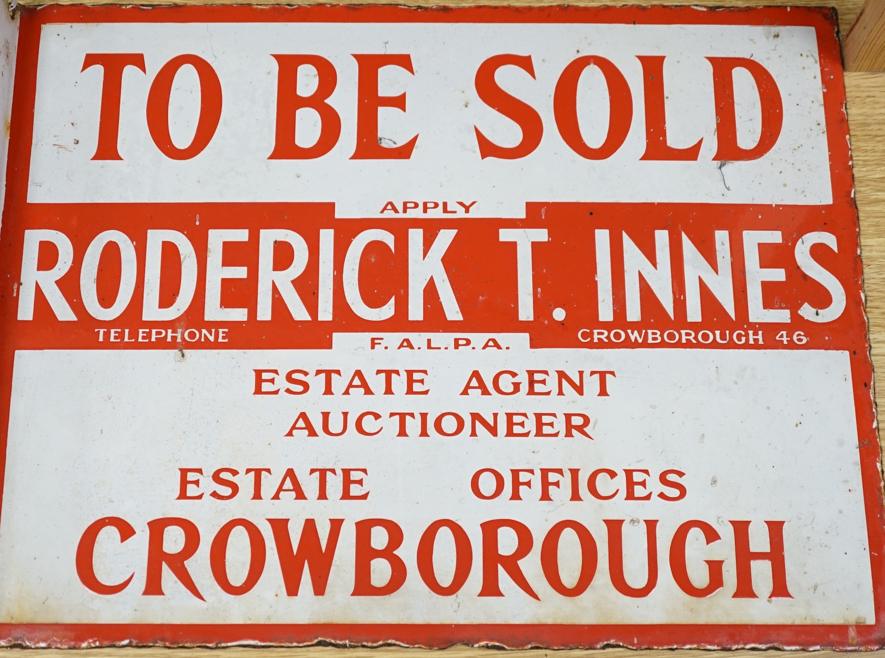 Two early 20th century 'Parris' and 'Innes', Crowborough, enamelled estate agent signs, 46cm wide. Condition - enamelling fair, edges mis-shapen